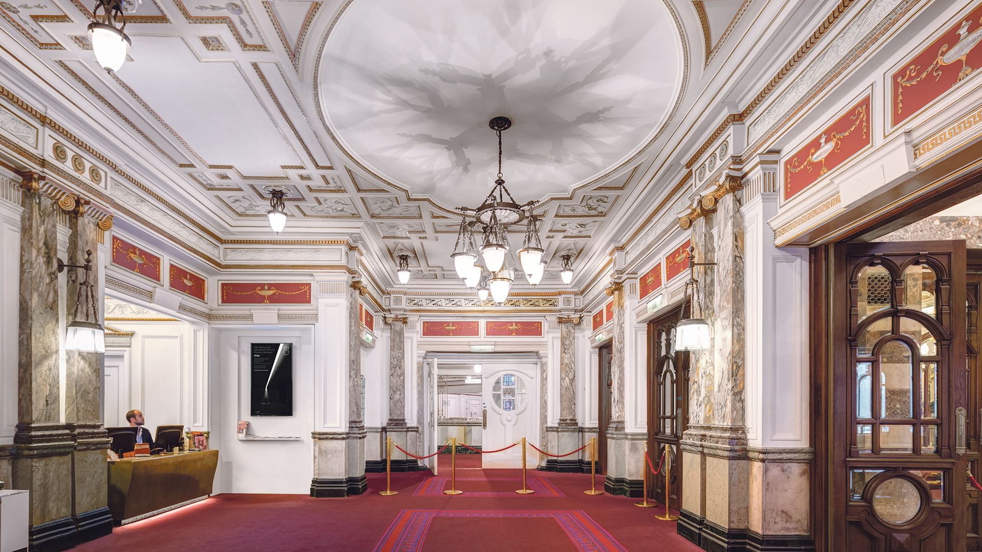 London Coliseum foyer with man at desk